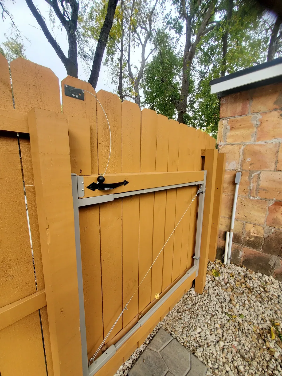 Custom cedar gate with cable bracing