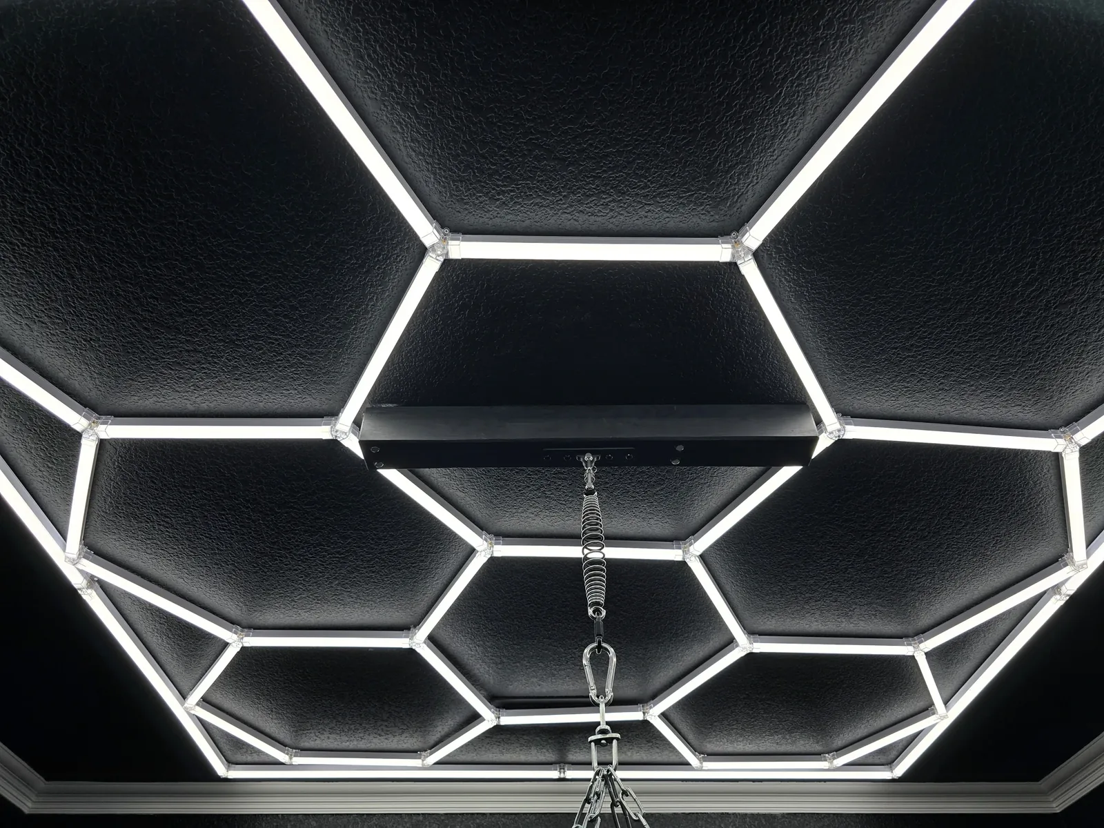 Hex LED ceiling grid — close-up