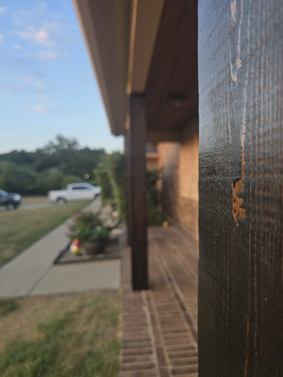 Detail of a stained cedar post wrap