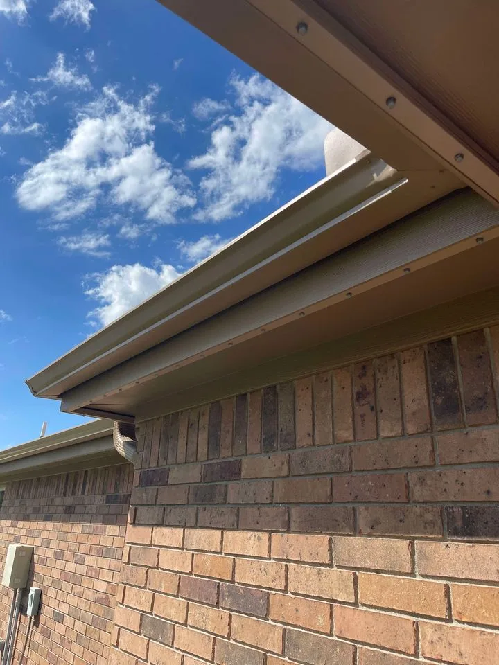 Low-profile permanent lighting track mounted along the roofline, barely visible by day