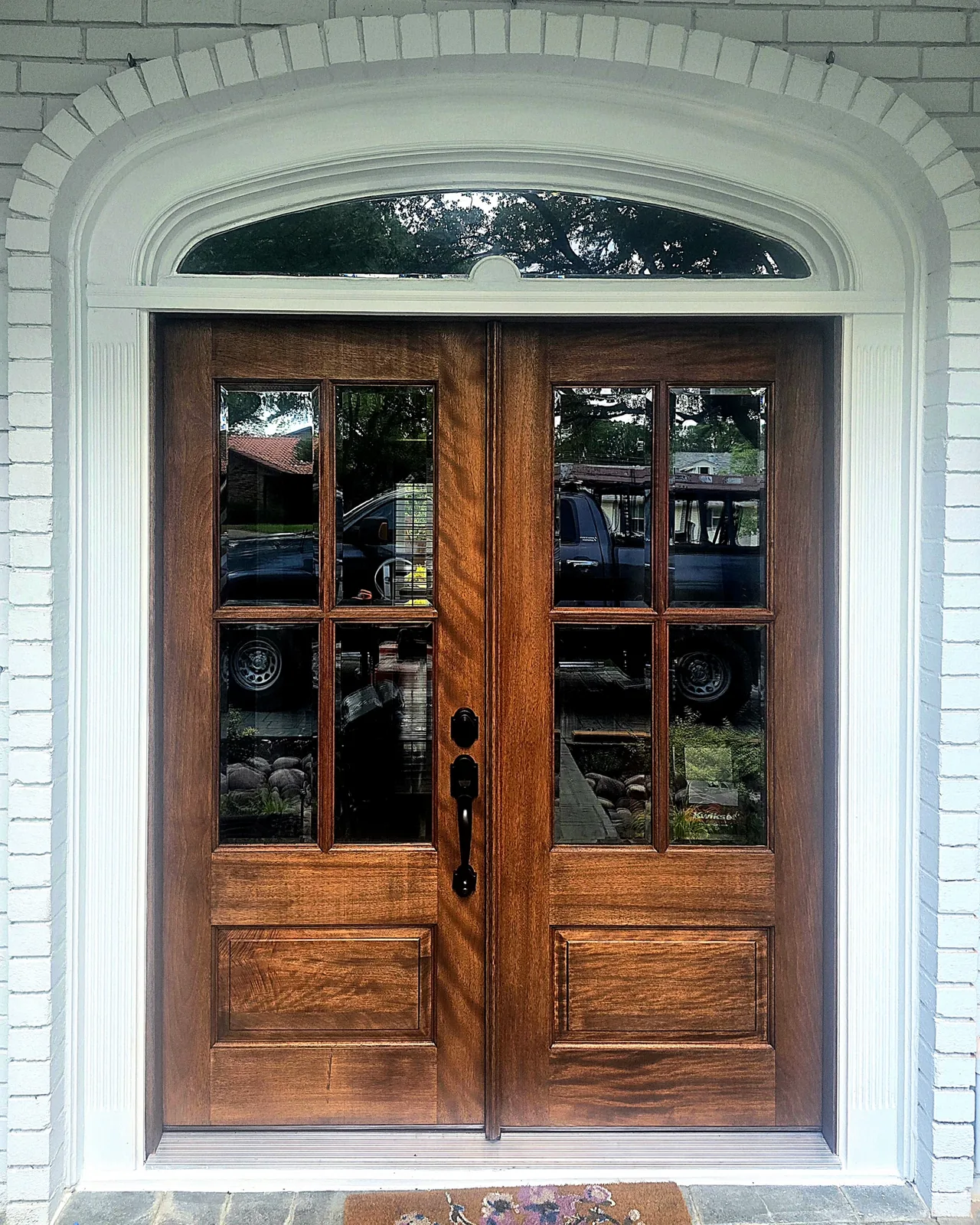 Stained wood double-door install